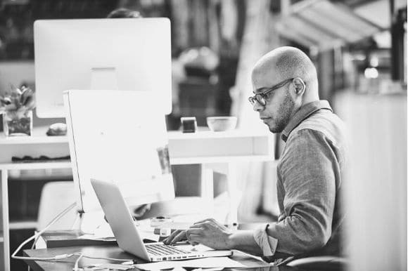 An account specialist diligently working at his desk.