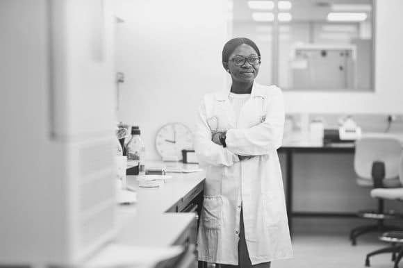 A laboratory manager stands in the lab.