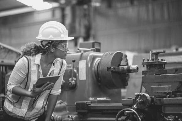 Operations engineer inspecting equipment in warehouse