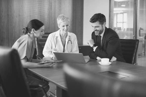 A salesperson meets with prospective clients.