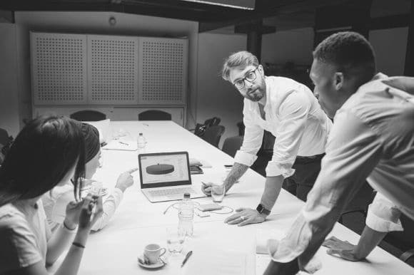 A recruiting team going over which marketing infographics to use on their hiring website.