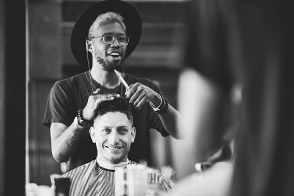 A hair stylist working on a client's hair.