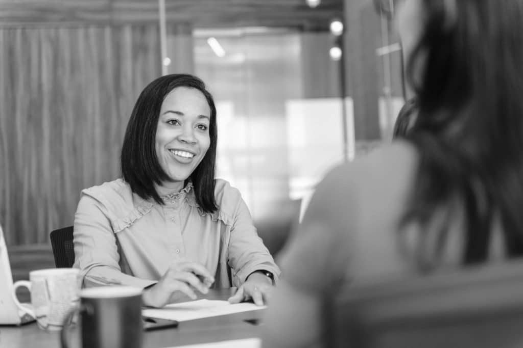 Bookkeepers collaborate in an office.