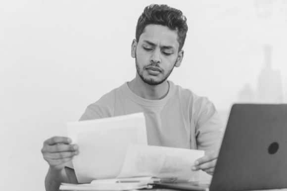 Assistant controller reviewing documents in an office