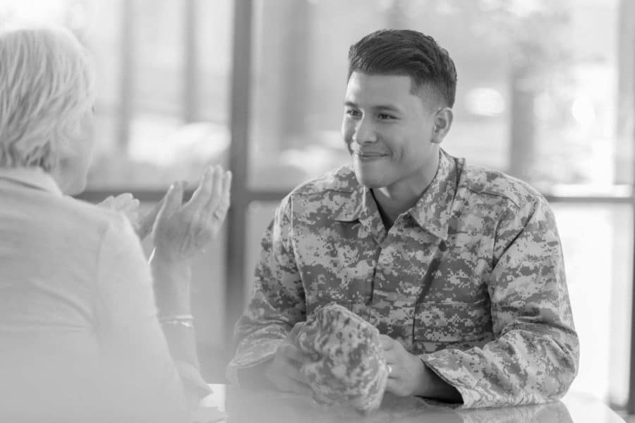 A man and woman sitting at table talking
