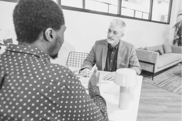 architect being interviewed at an office