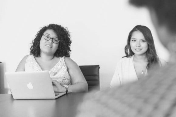 Web Developer being interviewed in conference room