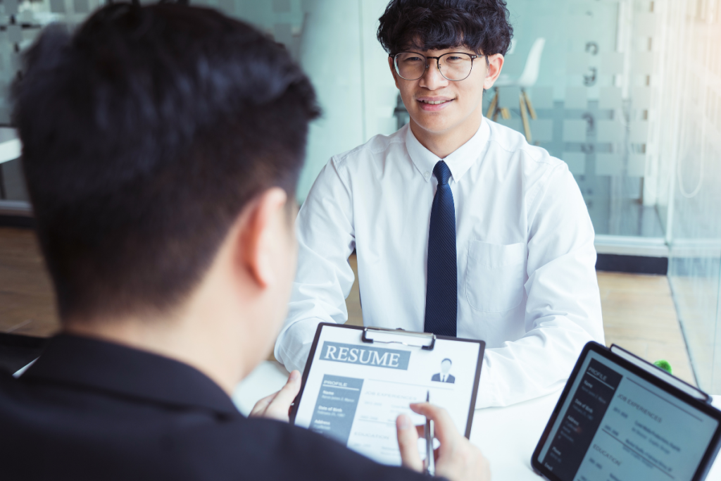 job seeker has a resume reviewed by a potential employer during a job interview.