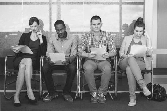 Four job candidates waiting for their interviews.