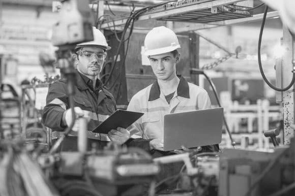 Supervisor at an assembly plant discussing employee performance issues.