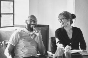 Boomerang employee laughing with coworker in office