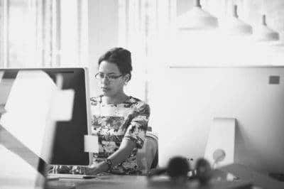 Data entry employee typing on a computer in an office