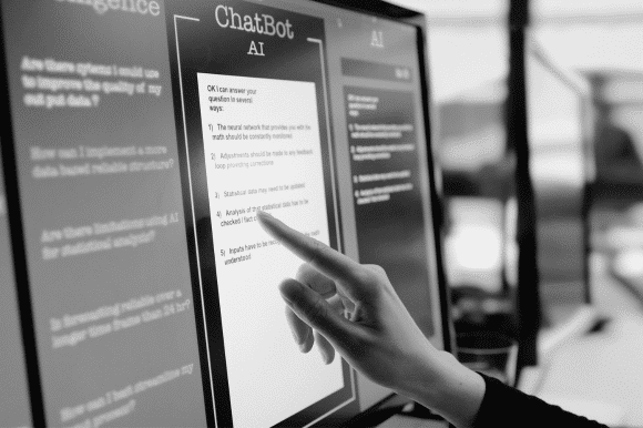 a hand pointing to a touchscreen searching on ChatGPT or other AI platform